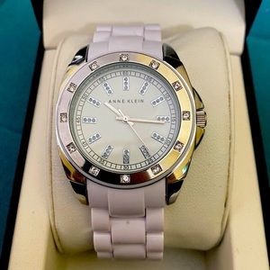 Brand new Anne Klein White enamel Watch. Faux diamond plated face plate.